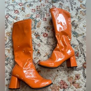 Orange knee high disco boot